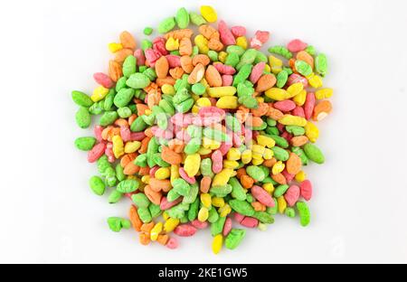 Colorful puffed rice sweets. Pile of rainbow drops cand isolated on white background Stock Photo