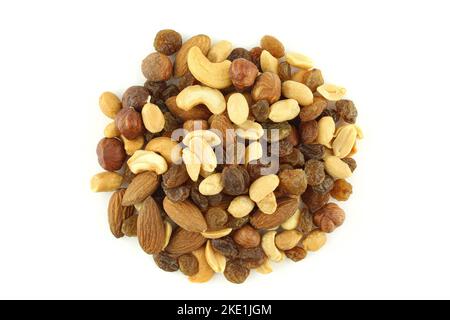 Mixture of nuts and raisins isolated on white background. Student mix with raisins,peanuts,hazelnuts,roasted almonds and cashew nuts Stock Photo