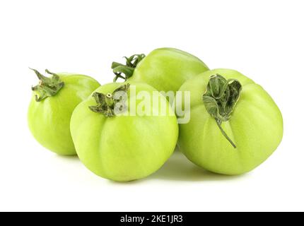 Group of green tomatoes isolated on white background Stock Photo