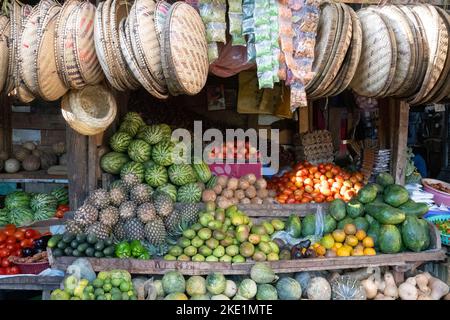 A fruit and vegetable stand in a market in karatu, Tanzania, selling also woven baskets. Stock Photo