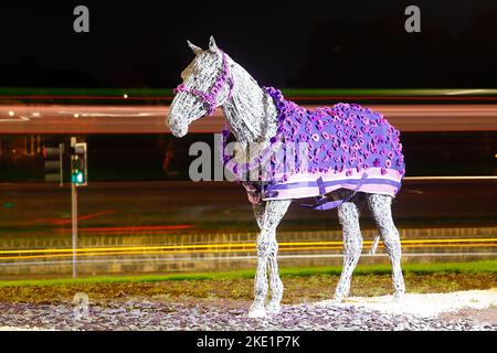 The Horse sculpture at Horsforth in Leeds has been given a new Purple Poppy Coat by Murphy's Army Purple Poppy Campaign Stock Photo