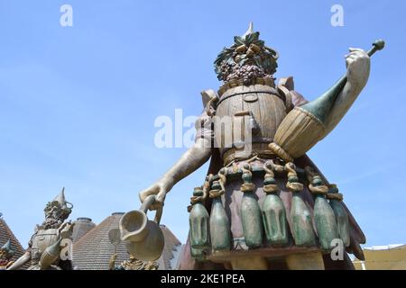 Statue of Enolo winemaker standing in a group of statues of The Food People by Dante Ferretti at the Expo Milano 2015. Stock Photo