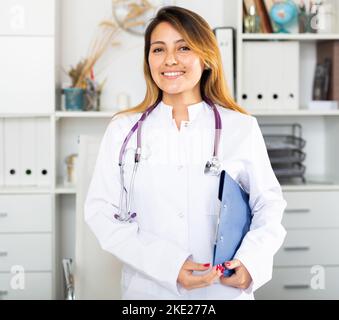 Latina female doctor standing in office Stock Photo