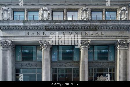 Toronto, Canada - November 2022:  Close-up view of the ornate stone decorations on a bank building in Toronto's financial district on Bay Street, cons Stock Photo