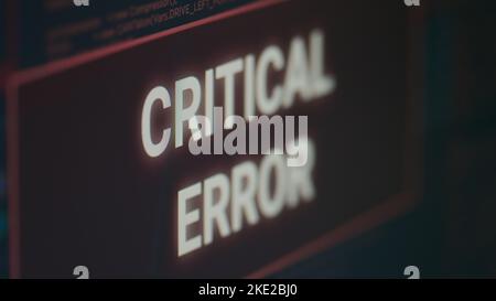 Computer displaying critical error message flashing on screen after cyber crime attack and hacking alert. Monitor display showing computer malfunction and error threat, system crash. Close up. Stock Photo