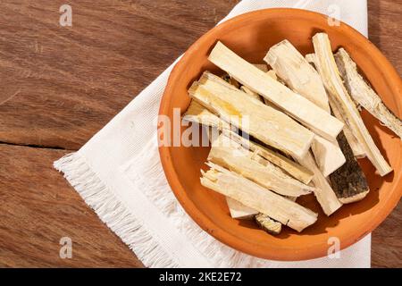 Quassia Amara - Stems Of Quassia Medicinal plant; On Wood Background Stock Photo