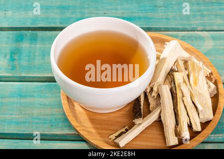 Quassia Amara - Beverage Stems Of Quassia Medicinal plant; On Wood Background Stock Photo