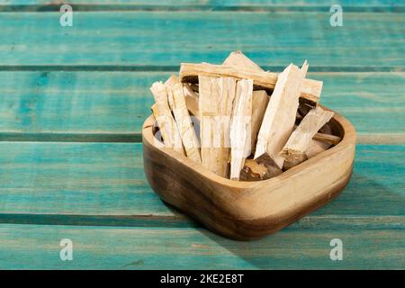 Quassia Amara - Stems Of Quassia Medicinal plant; On Wood Background Stock Photo