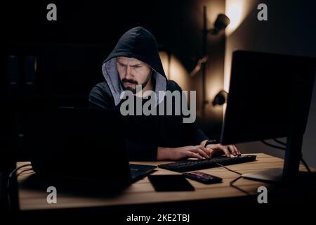 Hacker with computers Stock Photo