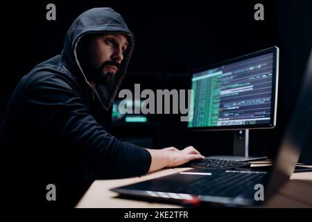 Computer specialist doing cyber attack Stock Photo