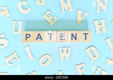 Patent business concept. Word typography on wooden blocks flat lay. Stock Photo
