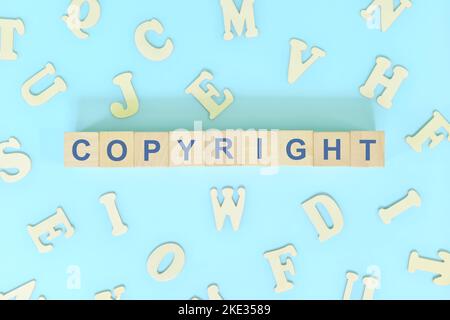 Copyright business concept. Word typography on wooden blocks flat lay. Stock Photo