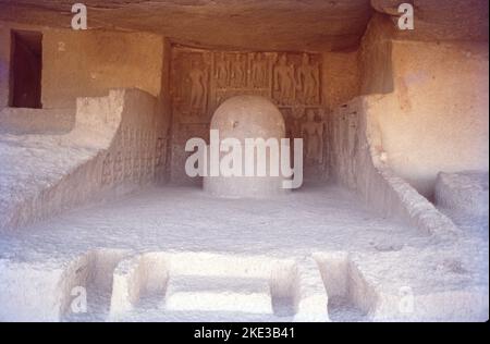 The Kanheri Caves are a group of caves and rock-cut monuments cut into a massive basalt outcrop in the forests of the Sanjay Gandhi National Park, on the former island of Salsette in the western outskirts of Mumbai,Once the caves were converted to permanent monasteries, their walls were carved with intricate reliefs of Buddha and the Bodhisattvas. Kanheri caves were built in the 1st century and had become an important Buddhist settlement on the Konkan coast by the 3rd century CE. Stock Photo