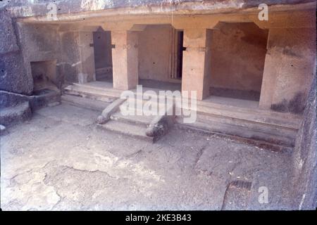 The Kanheri Caves are a group of caves and rock-cut monuments cut into a massive basalt outcrop in the forests of the Sanjay Gandhi National Park, on the former island of Salsette in the western outskirts of Mumbai,Once the caves were converted to permanent monasteries, their walls were carved with intricate reliefs of Buddha and the Bodhisattvas. Kanheri caves were built in the 1st century and had become an important Buddhist settlement on the Konkan coast by the 3rd century CE. Stock Photo