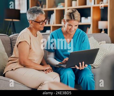 Home visit, woman and doctor with laptop on sofa checking medical results or chart online. Healthcare, technology and nurse or caregiver help Stock Photo