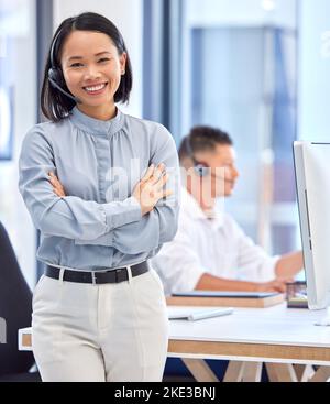 Call center, customer support and portrait Asian woman in the office, working with smile on face. Leadership, management and businesswoman standing in Stock Photo