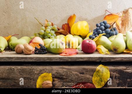 autumn crop on the wooden board. lots of ripe fruits. natural grown food and rural lifestyle Stock Photo