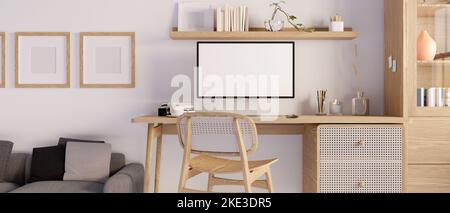 Minimal Scandinavian home working space interior with PC desktop computer mockup on minimal wood table, wood shelf, comfy couch, frame mockup and wall Stock Photo