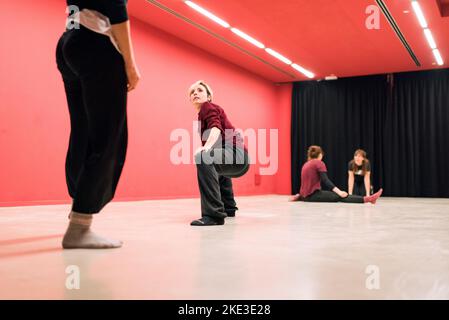 theater students doing physical exercises on the floor Stock Photo
