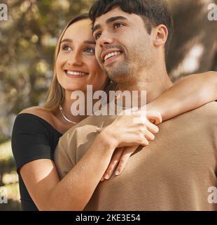 Love, date and view with a couple sightseeing outdoor in nature or a park together in summer. Travel, dating and romance with an attractive young man Stock Photo