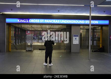 A man looks at the closed shutters at the entrance to King's Cross station in central London, during a strike by members of the Rail, Maritime and Transport union (RMT) and Unite, in a long-running dispute over jobs and pensions. The strike by transport workers in London is expected to cause travel chaos with limited services on the Tube. Picture date: Thursday November 10, 2022. Stock Photo