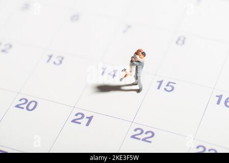 Miniature toys of couple celebrate love, valentines or other romantic moments concept on 14 February annually. Stock Photo