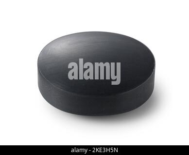Solid soap mixed with black charcoal placed on a white background. Stock Photo