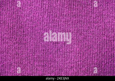 Structure of purple colored fabric as background. Stock Photo