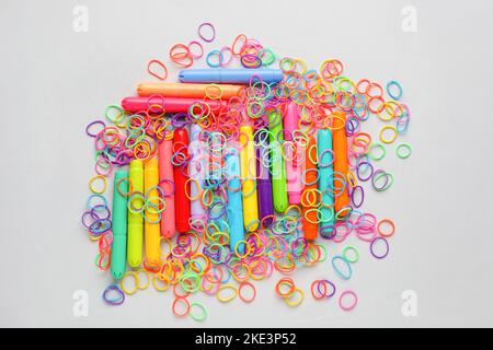 Collage of colorful rubber bands on white background Stock Photo - Alamy