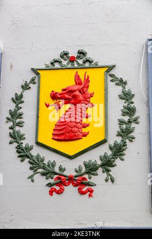 A welsh dragon shield on a pub in Barmouth Wales Stock Photo