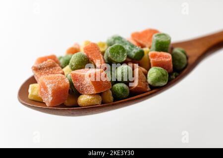 Frozen mixed vegetables on a white background Stock Photo