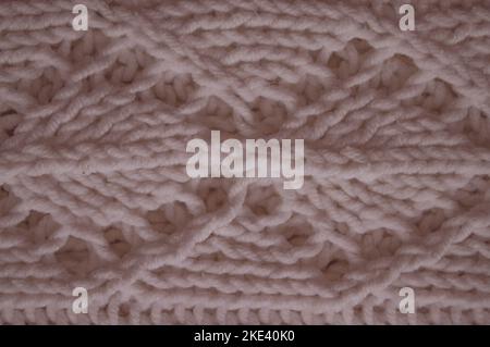 Organic knitted background with macro woven threads. Stock Photo