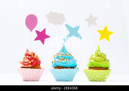Colorful cupcakes isolated on white background Stock Photo