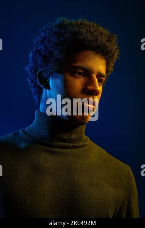 Young confident man posing for camera studio shot Stock Photo