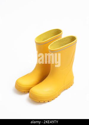 Yellow rubber boots isolated on white Stock Photo