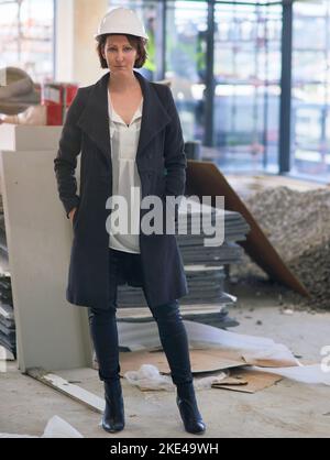 Im building a great career. Portrait of a female construction manager on site wearing a hardhat. Stock Photo