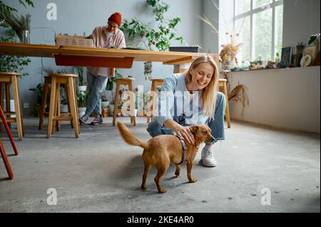 Young people working at florist workshop Stock Photo