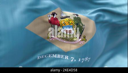 Close-up view of the Delaware state flag waving in the wind. Delaware is a state in the Mid-Atlantic region of the United States. Fabric textured back Stock Photo
