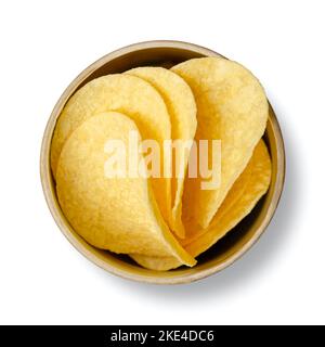 Salted potato chips, in an opened cardboard can, from above. Thin slices of American stackable potato-based crisps, with a content of 42 % potatoes. Stock Photo