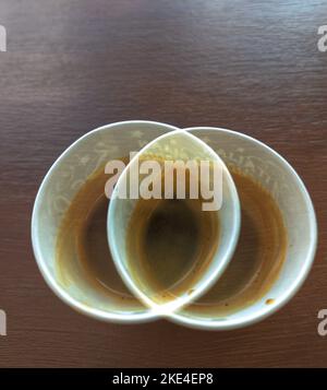 a glass of coffee stands on a wooden table Stock Photo
