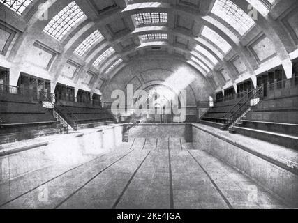 Marshall Street Baths, London, c1934. The present building, originally known as The Westminster Public Baths, was started in 1928 and completed in 1931. Public funds financed the construction of the baths, which were intend to improve the health and well-being of local residents. The main swimming pool is lined with white Sicilian marble and this marble as well as Swedish green marble cover the walls at either end of the pool. Stock Photo