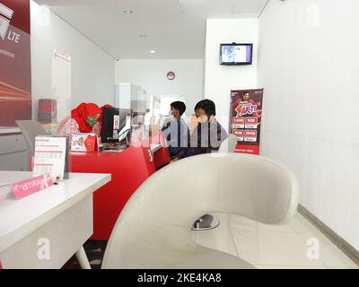 Customer service at grapari telkomsel, telkomsel card customers can get service assistance and complaints at grapari office Stock Photo