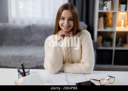 Woman doing homework Stock Photo