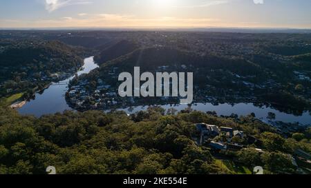 Aerial view of Woronora River surrounded by lush greenery and Woronora Bridge in Sutherland suburb South Sydney, NSW, Australia Stock Photo