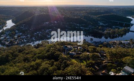 Aerial view of Woronora River surrounded by lush greenery and Woronora Bridge in Sutherland suburb South Sydney, NSW, Australia Stock Photo