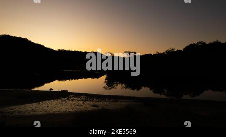 Aerial view of Woronora River surrounded by lush greenery at sunset in Sydney, New South Wales, Australia Stock Photo