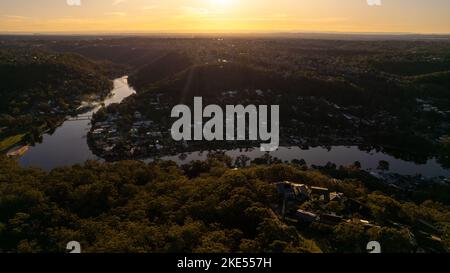 Aerial view of Woronora River surrounded by lush greenery and Woronora Bridge in Sutherland suburb South Sydney, NSW, Australia Stock Photo