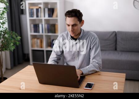 Man working on laptop Stock Photo