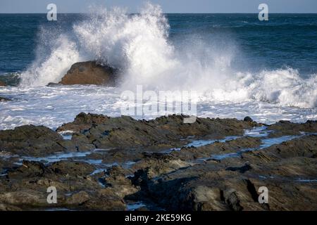 Waves breaking on rocks at Prawle Point, East Prawle, Devon Stock Photo