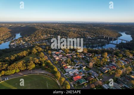 Aerial view of sporting ground,Sutherland Oval, Woronora River and Sutherland suburb surrounded by lush greenery, Sydney, NSW, Australia Stock Photo